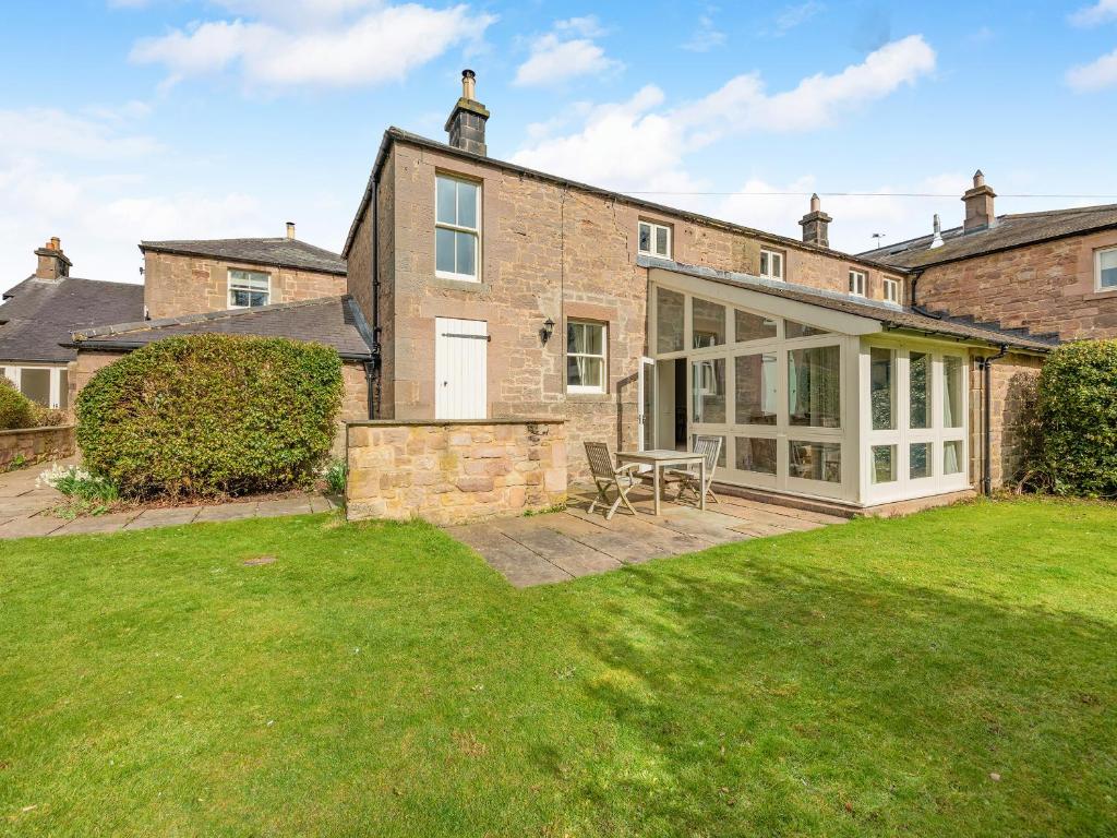 an exterior view of a brick house with a lawn at Wellwood - Uk49290 in Preston
