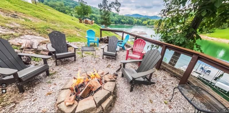 a group of chairs sitting around a fire pit at Cove Manor in Maynardville