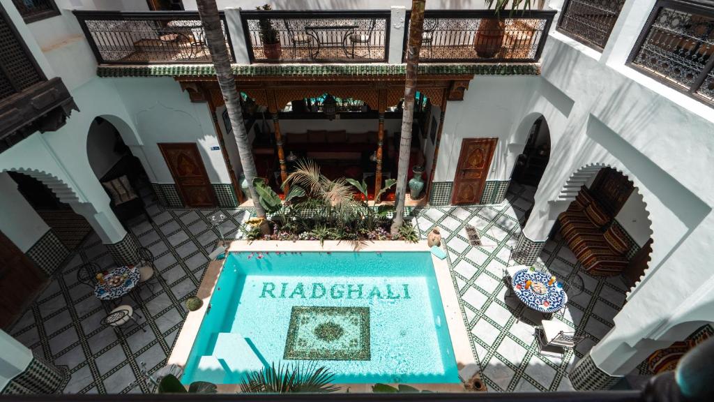 an overhead view of a building with a pool in a courtyard at Riad Ghali Hotel & SPA in Marrakesh