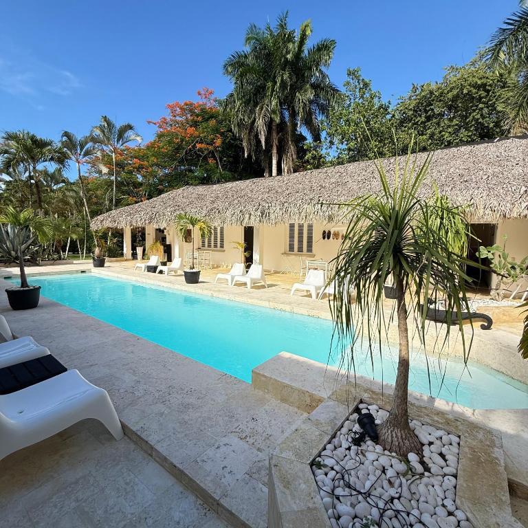 a villa with a swimming pool and a resort at Terra Taina Boutique Bed&Breakfast in Las Terrenas