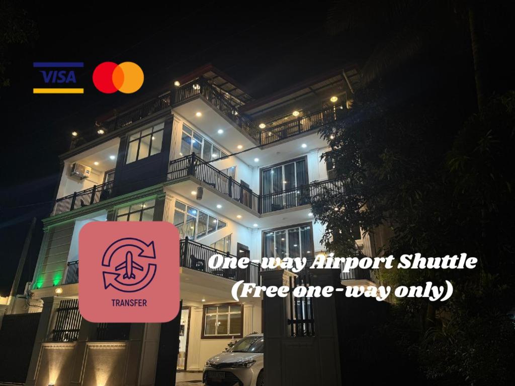 a building with a sign in front of it at Aloe Transit Hotel in Katunayaka