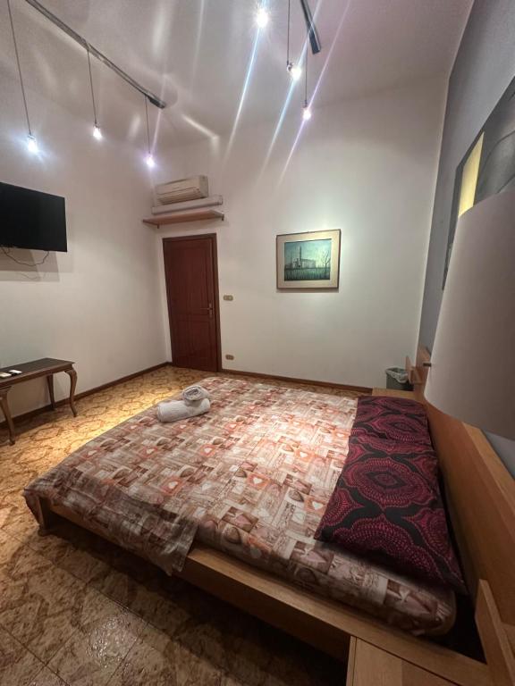 a bedroom with a large bed in a room at Bnb fantasia in Bologna