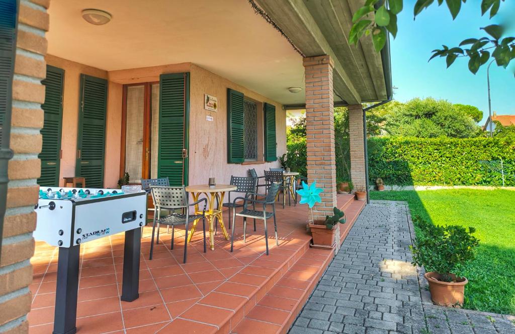 a patio with chairs and a table on a house at Bed and Breakfast La Contessa in Santo Stefano