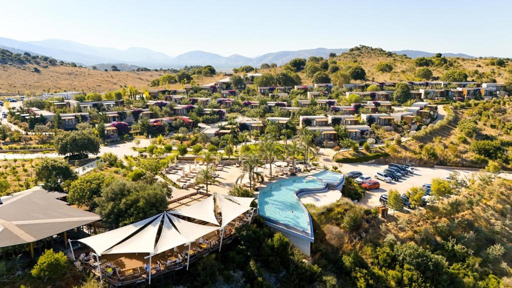 an aerial view of a resort with a pool at ARAMERAS Resort in Ksamil