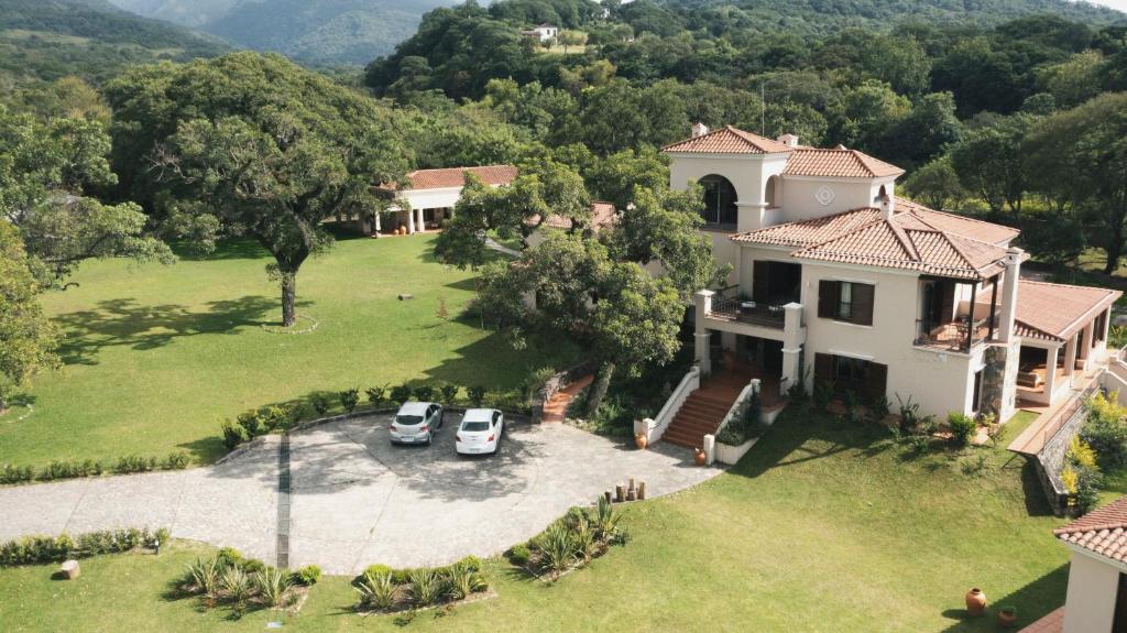 an aerial view of a house with cars parked in a yard at Rincon del Cerro I in San Lorenzo
