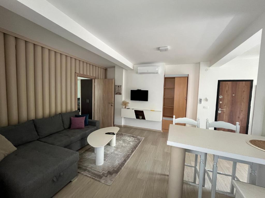 a living room with a couch and a table at Rayand in Mostar