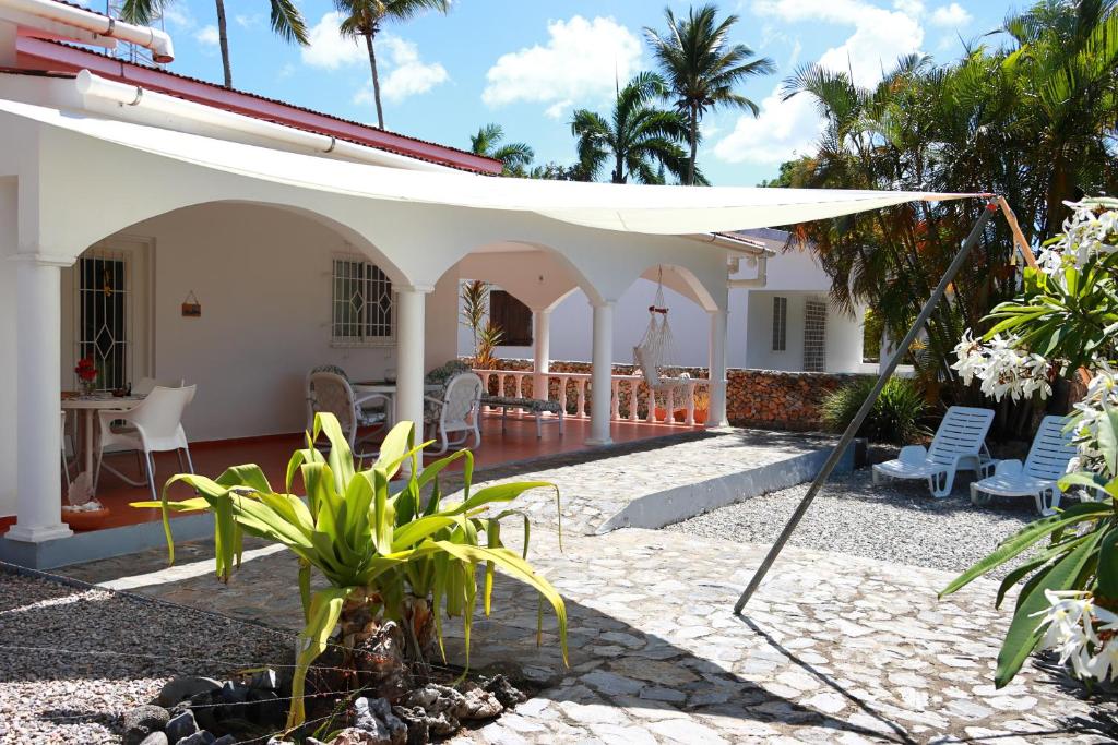 a white awning over a patio of a house at Casa M&B in Las Galeras