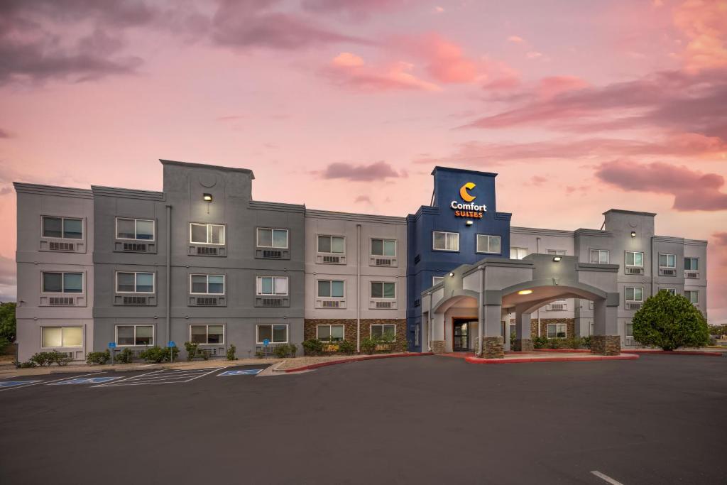 a rendering of a hotel with a building at Comfort Suites Albuquerque-North Journal Center in Albuquerque