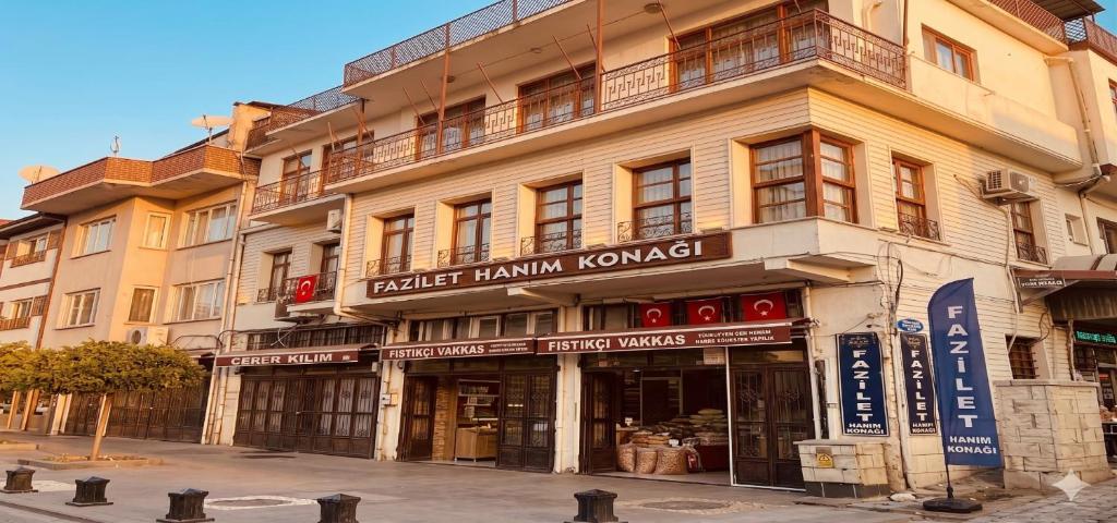 a large building with signs on the side of it at Fazilet Hanım Konağı in Şahinbey