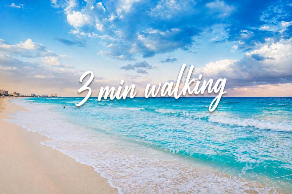a picture of the beach with the words min walking at The White Villa in Cancún