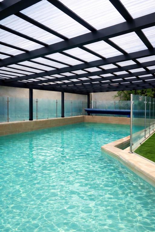 a large pool of water with a roof at אחוזת רוממה - Villa Romema in Safed