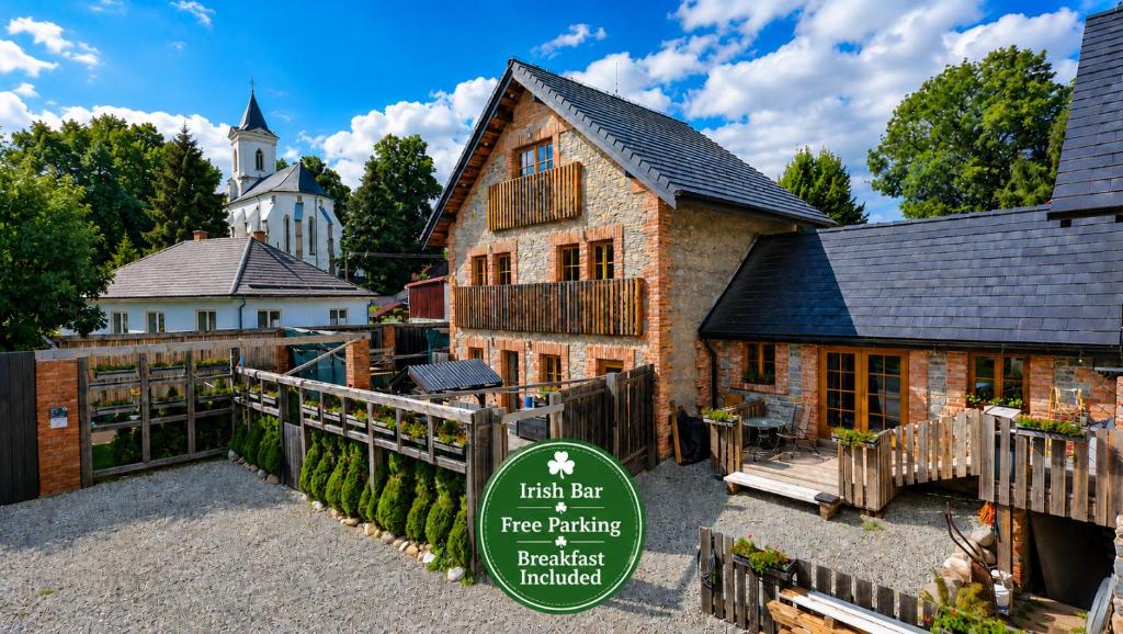 a building with a sign in front of it at Liptov Lodge in Liptovský Mikuláš