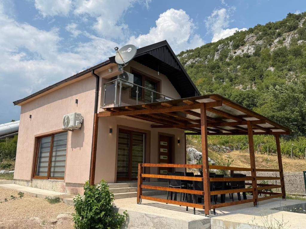 a small house with a solarium on top of it at House Tickon Ostrog in Trubasinj
