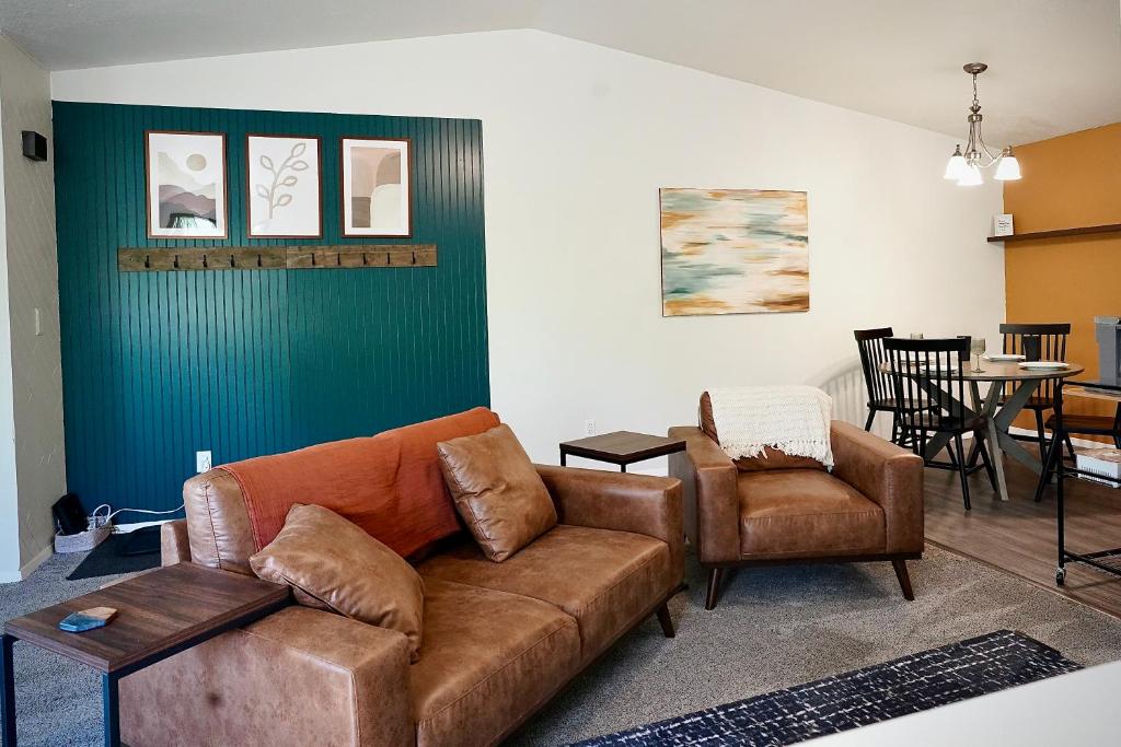 a living room with a couch and a chair at Pet-Family-Friendly Duplex with Parking in Wasilla