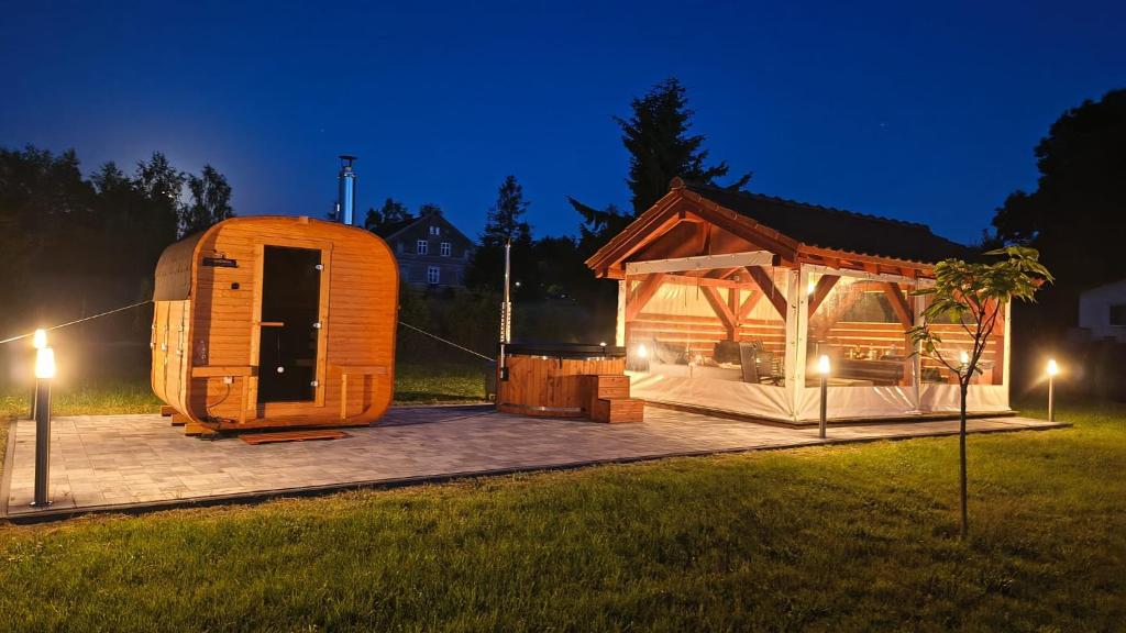 an igloo house in a field at night at POD DĘBEM in Cerkiewnik