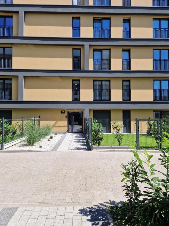 an apartment building with a driveway in front of it at Lubanska by Tauron Arena in Zgorzelec
