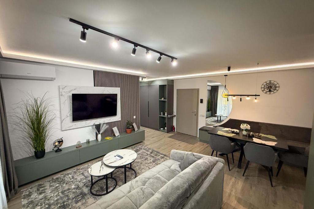 a living room with a couch and a table at Stay Unique in Râşnov