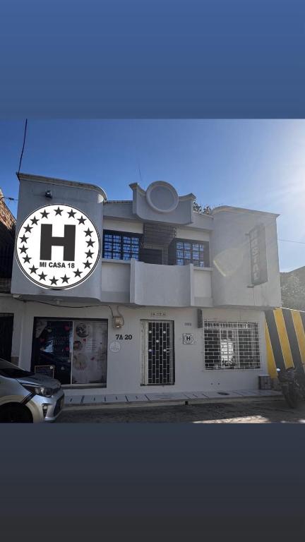 a building with a clock on the side of it at Mi Casa18 in Santa Marta