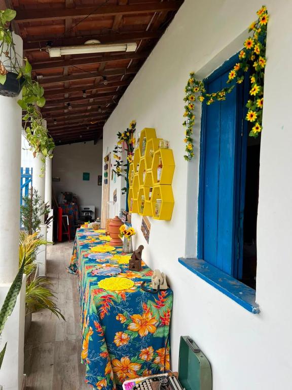 a row of tables lined up against a wall at Casa Velha Hospedagem Jacuípe in Camaçari