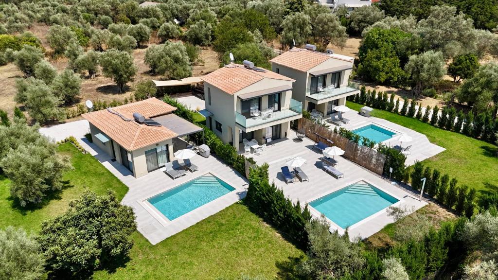 an aerial view of a house with two swimming pools at Anmaria Luxury in Lefkada