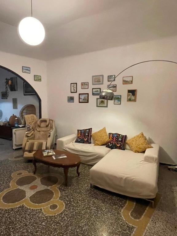 a living room with two couches and a table at Baia Serena in Sestri Levante