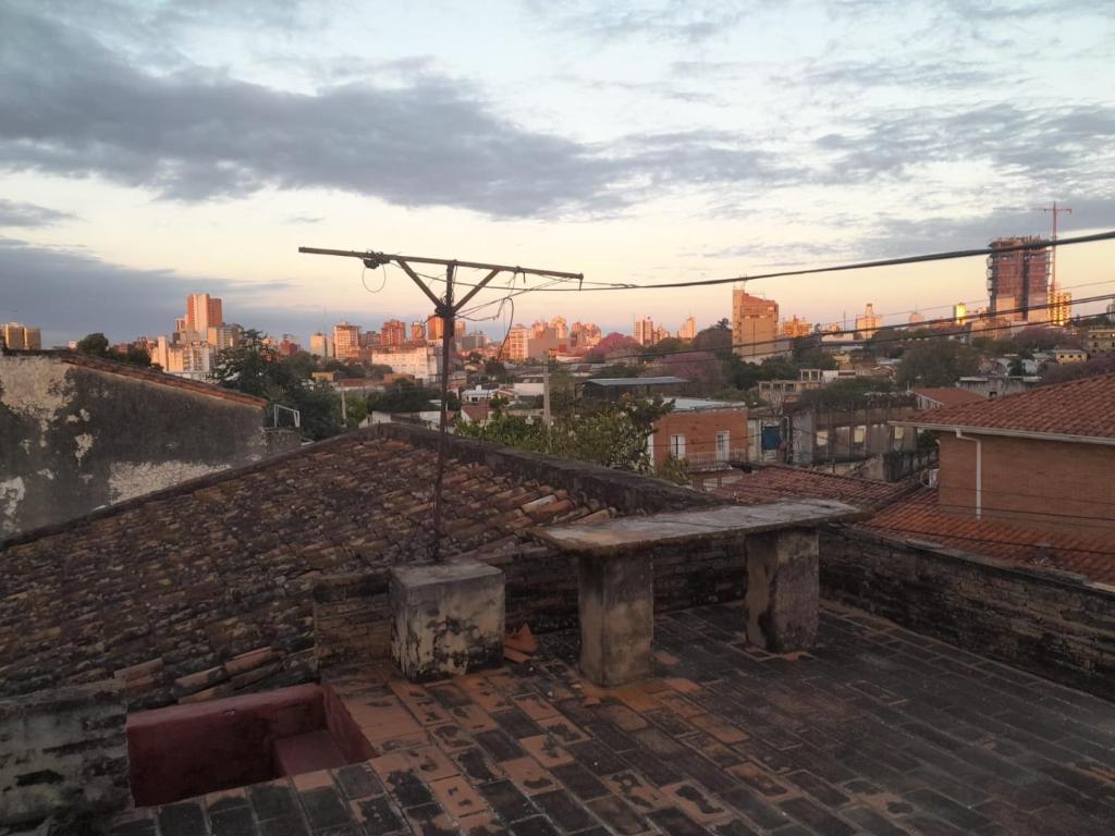 a bench sitting on the roof of a building at Tata Róga in Asunción