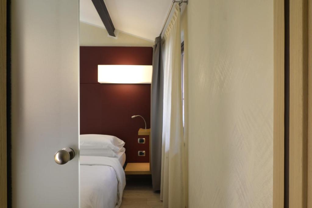 Postel nebo postele na pokoji v ubytování Best Western Hotel Armando