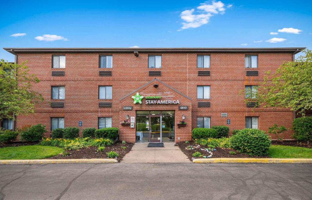a red brick building with a star on the front at Extended Stay America Suites - Fort Wayne - North in Fort Wayne