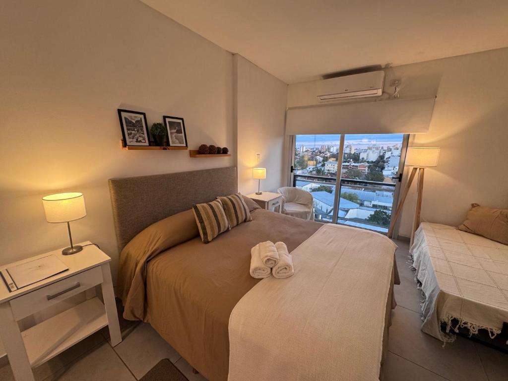 Llit o llits en una habitació de Departamento Studio