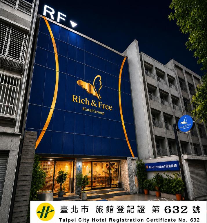 a building with a sign on the side of it at Rich & Free Hotel - Zhongshan in Taipei