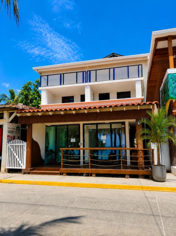 a building with glass windows on a street at Solea by The Sea in Roatán