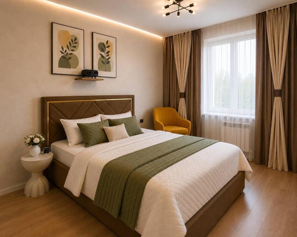 a bedroom with a large bed and a window at Elim-Ai in Kokshetau