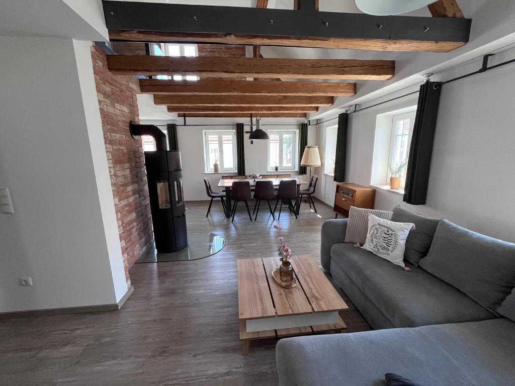 a living room with a couch and a table at Ferienwohnung Sabrina in Aichen
