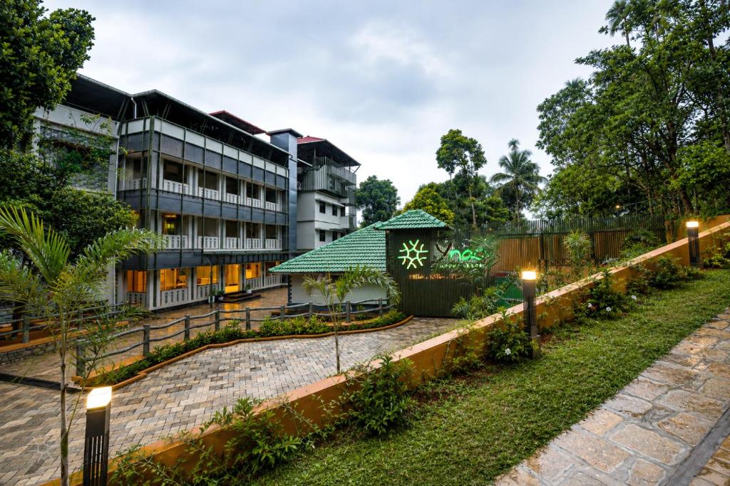 a view of the hotel from the garden at Ynad Mount Resort in Meppādi