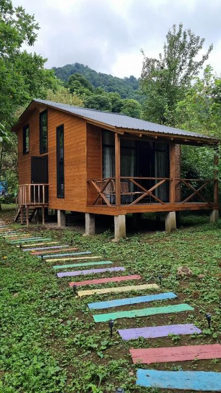 a house with stepping stones leading to it at Babitouli-3 in Niabauri