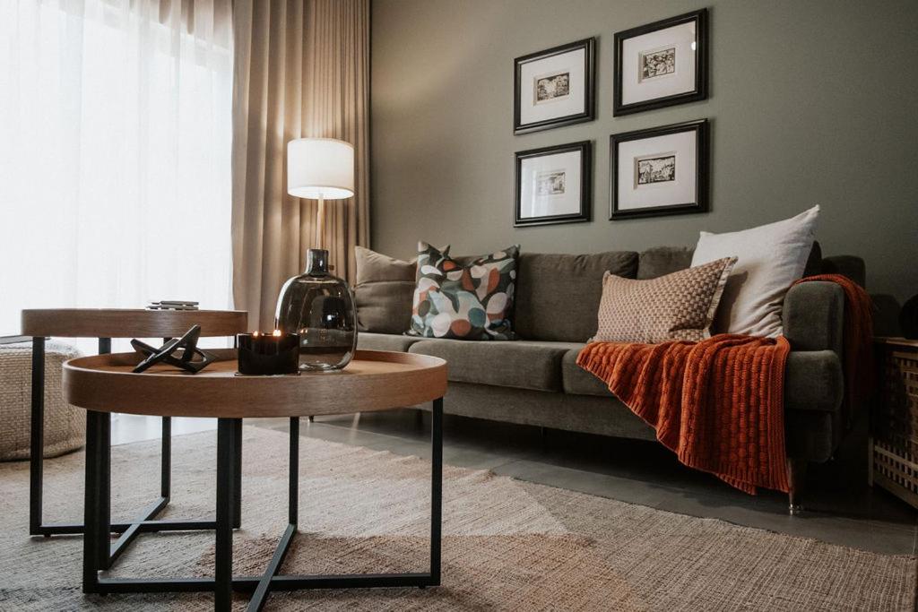 a living room with a couch and a table at IBella's at The Urban in Pretoria