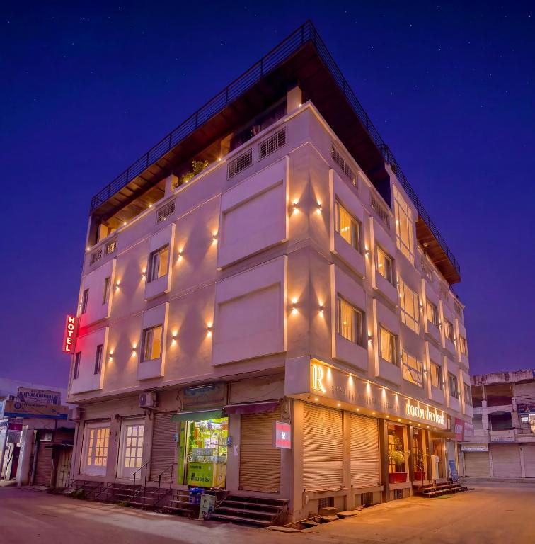 a white building with lights on the side of it at RION - A Boutique Hotel in Udaipur