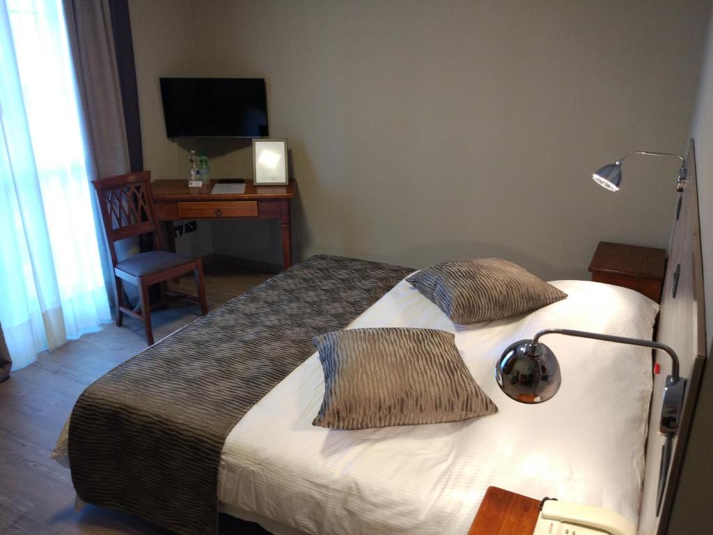 Postel nebo postele na pokoji v ubytování Albergo Ristorante San Biagio