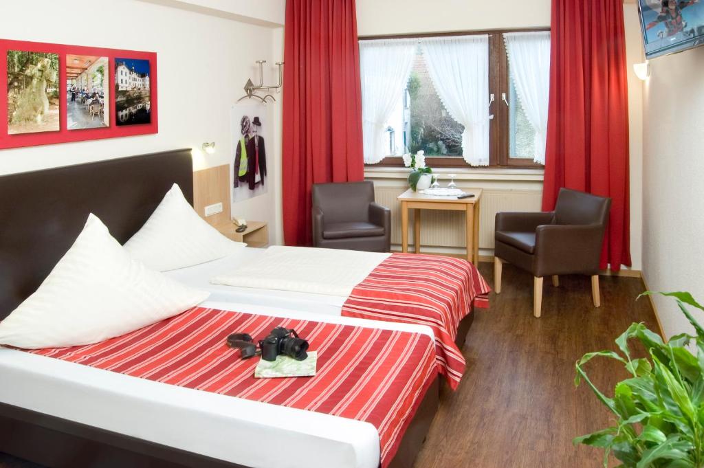 Postel nebo postele na pokoji v ubytování Hotel Hauer