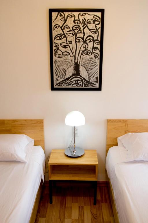 Postel nebo postele na pokoji v ubytování Hostal Tres Central