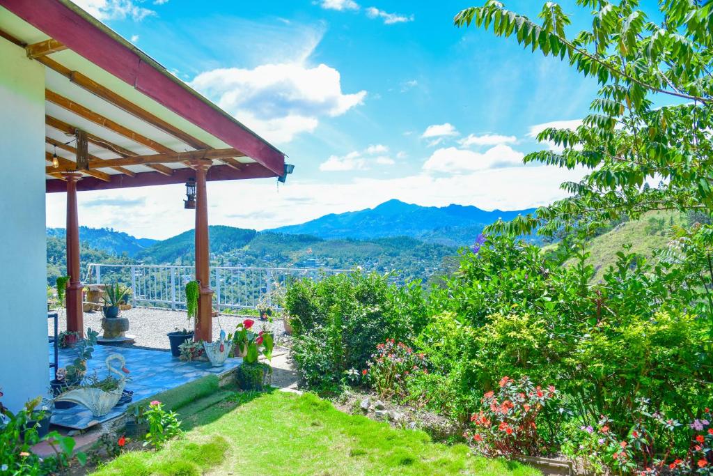 a house with a view of the mountains at Ella Black Bridge Grand View Cottage Sri Lanka in Ella