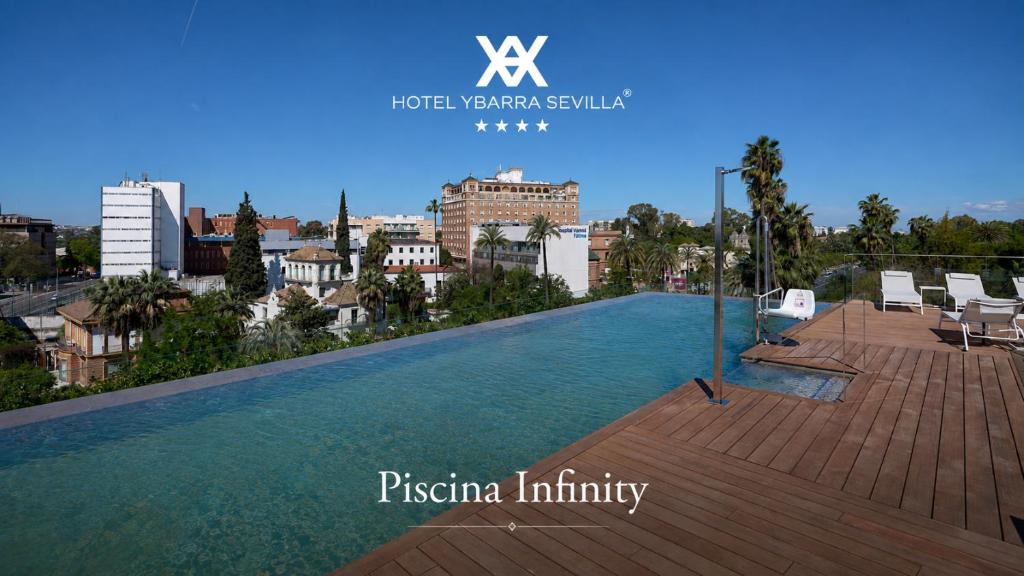 a swimming pool on the roof of a building at Hotel Ybarra Sevilla in Seville