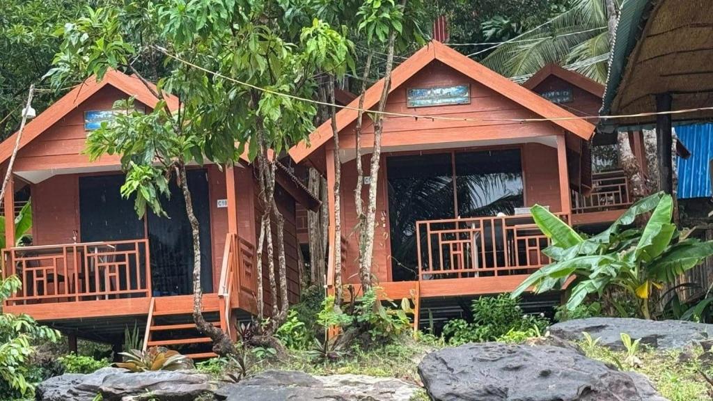 a wooden house in a forest with trees at Europe Enchanted Resort in Kaôh Rŭng (3)
