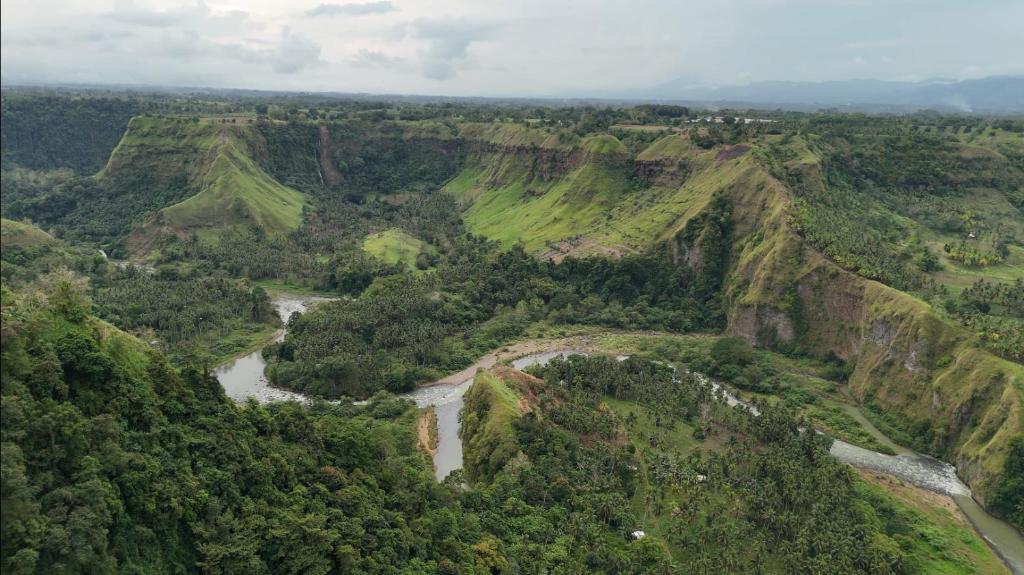 an aerial view of a river in a canyon at Thrill Playgrounds & Tipi Cafe in Libona