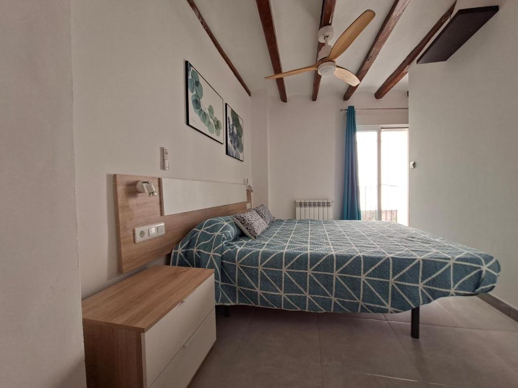 En eller flere senge i et værelse på MORELLA CENTRO Apartamento-Loft