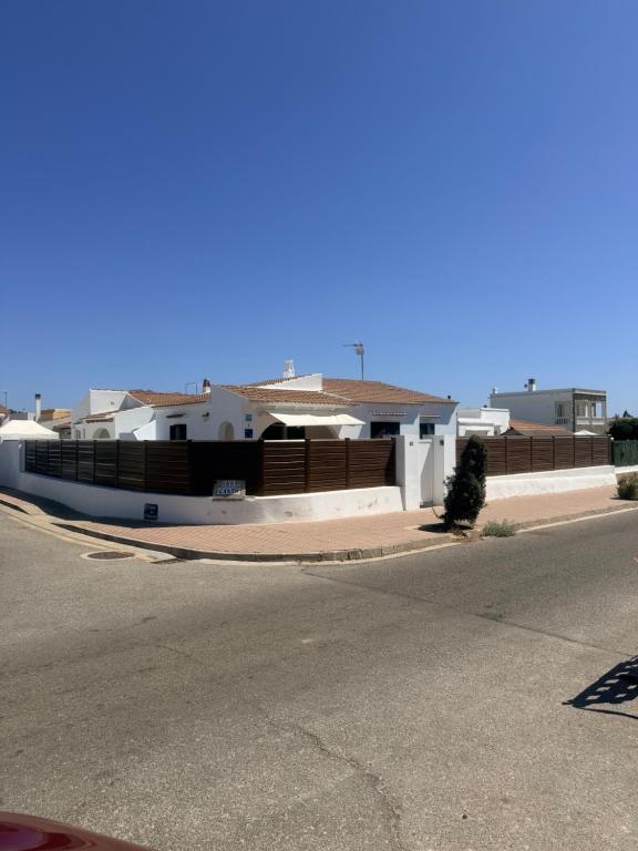 a house on the side of a street at Es Canto in Cala Blanca
