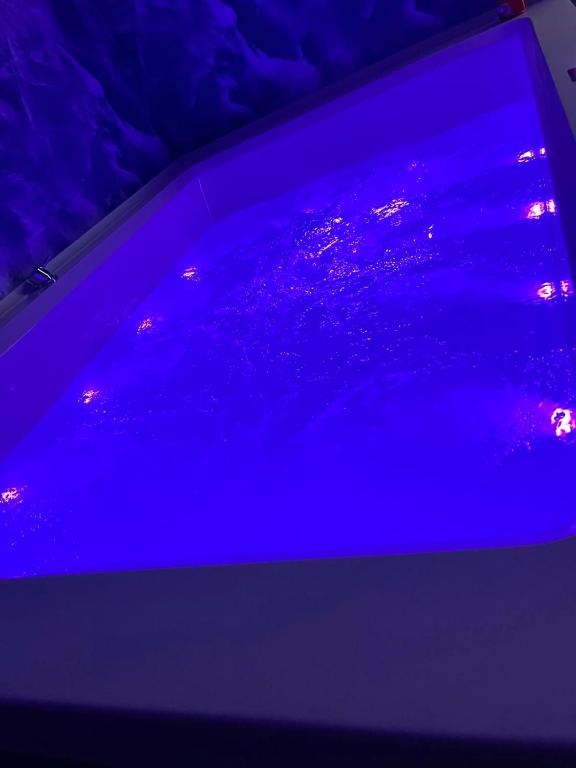 a purple light on the hood of a car at Esmeralda B&B in Casa San Biagio