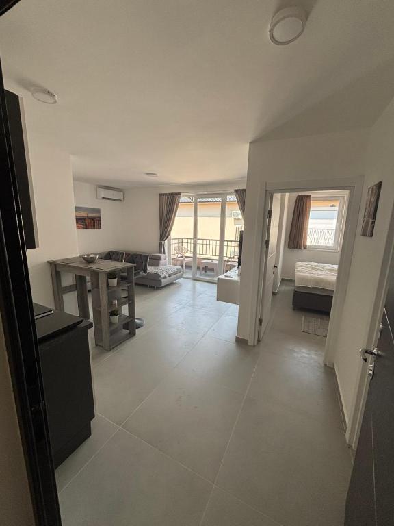 a large living room with a table and a couch at Andrejić 1 in Veliko Gradište