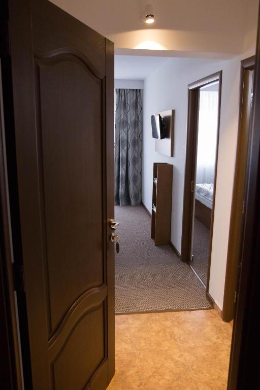 Postel nebo postele na pokoji v ubytování Hotel Magurele
