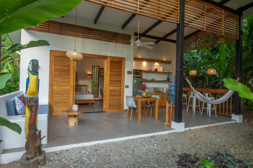 a living room and dining room with a dining table at Villa Lapa 10-15 min walking to the beach in Punta Uva